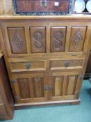 A CARVED OAK CABINET DROP FRONT TOP SECTION ABOVE DRAWERS AND CUPBOARDS, H 118 x W 92 x D 38cms
