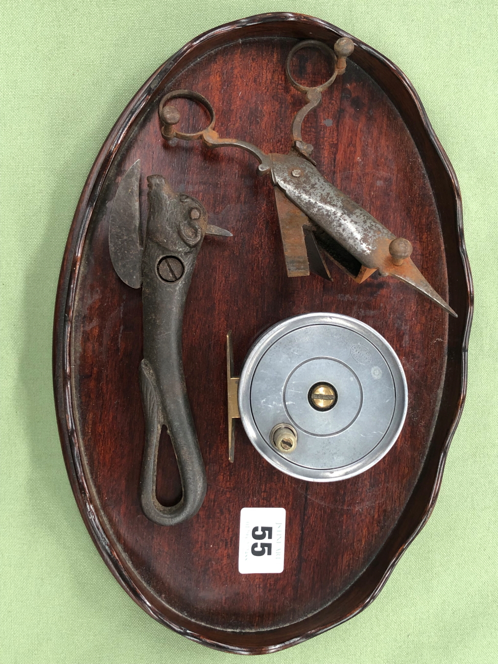 A SMALL MAHOGANY OVAL WINE TRAY WITH WAVY GALLERY EDGE 30CM LONG TOGETHER WITH AN ANTIQUE BULLS HEAD