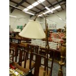 A VINTAGE STYLE BRASS FINISH ADJUSTABLE FLOOR LAMP