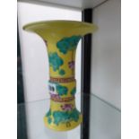 A ORIENTAL CHINESE OF HU FORM VASE WITH YELLOW GROUND AND FLORAL DECORATION.