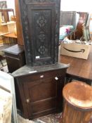 A 19th C. MADE OAK HANGING CORNER CABINET H 92 W 78 D 42cms TOGETHER WITH A SMALLER LATER CARVED