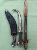 A GURKHA KNIFE WITH SHEAF, TOGETHER WITH A FURTHER EASTERN KNIFE AND A LEATHER INLAID WHIP.