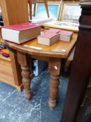 A PINE OVAL DROP FLAP TABLE ON BALUSTER TURNED LEGS. W 56 CLOSED x D 117 x H 77cms.