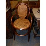 A VINTAGE BENTWOOD CHILDS HIGHCHAIR.