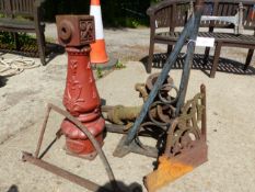A CAST IRON LAMP POST BASE, TWO PUMPS AND VARIOUS IRON WARES.