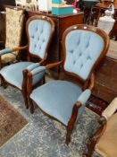 A PAIR OF MODERN MAHOGANY SHOW FRAME ARMCHAIRS BUTTON UPHOLSTERED IN PALE BLUE VELVET.