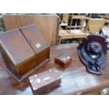 AN EDWARDIAN OAK STATIONARY CABINET TOGETHER WITH A MASK CARVED BRACKET ETC