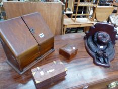 AN EDWARDIAN OAK STATIONARY CABINET TOGETHER WITH A MASK CARVED BRACKET ETC