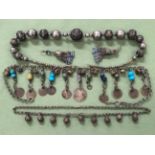 A VINTAGE TRIBAL NECKLACE SET WITH FILIGREE WORKED SPHERES, TOGETHER WITH A SMALLER EXAMPLE AND