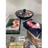 THREE MOORCROFT BOXES AND TWO ROYAL DOULTON FLAMBE PIECES