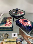 THREE MOORCROFT BOXES AND TWO ROYAL DOULTON FLAMBE PIECES