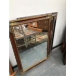 TWO RECTANGULAR MIRRORS IN SIMILARLY MOULDED FRAMES ONE WITH GILT CORNERS AND THE OTHER WITH