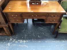 A 20th C. MAHOGANY TABLE WITH A CONFIGURATION OF FIVE DRAWERS, THE SQUARE LEGS TAPERING TO CERAMIC