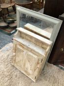 A RUSTIC PAINTED PINE HANGING CABINET TOGETHER WITH A PAINTED CONVEX MIRROR AND ANOTHER MIRROR OF