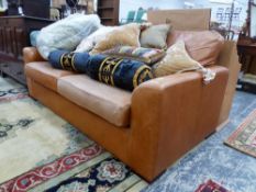 A BROWN LEATHER TWO SEATED SETTEE. W 182cms