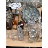 A THREE BOTTLE TANTALUS TOGETHER WITH SEVEN VARIOUS DECANTERS A COLLECTION OF DRINKING GLASSES, A