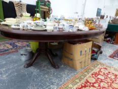 A LEATHER INSET MAHOGANY OVAL DINING TABLE ON TWO HEXAGONAL COLUMNS, EACH WITH FOUR LEGS. W 298 x