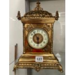 A ORNATE LARGE BRASS MANTEL CLOCK