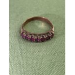 A 9ct GOLD HALLMARKED RUBY HALF ETERNITY RING WEIGHT 2.6grms