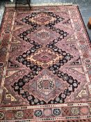 A MACHINE MADE RUG OF CAUCASIAN DESIGN 240 x 170 cms