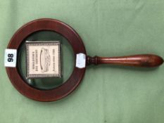 A EDWARDIAN MAGNIFYING GLASS AND A PREPARATION OF SINGLETONS EYE OINTMENT