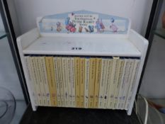 A BEATRIX POTTER THE ORIGINAL PETER RABBIT BOOK COLLECTION WITH BOOK STAND.
