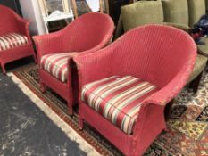 THREE PINK PAINTED LLOYD LOOM ARMCHAIRS WITH STRIPED CUSHION SEATS