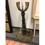 AN UNUSUAL EASTERN, HORN MOUNTED, FLOOR STANDING, CANDLE STAND CENTREPIECE.