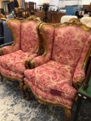 A PAIR OF IMPRESSIVE CARVED GILTWOOD CONTINENTAL LARGE WING BACK ARMCHAIRS