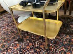 A RETRO BRASS FINISH TWO TIER TROLLEY