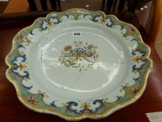 AN 18th C. FRENCH FAIENCE POLYCHROME DISH PAINTED WITH CENTRAL QUIVER AND CORNUCOPIA TROPHY. Dia.