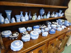 AN EXTENSIVE COLLECTION OF WEDGWOOD JASPER WARES, LIDDED BOXES, BELLS, VASES, CUPS AND SAUCERS,