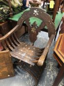 AN ANTIQUE CARVED AND INLAID SYRIAN FOLDING ARMCHAIR