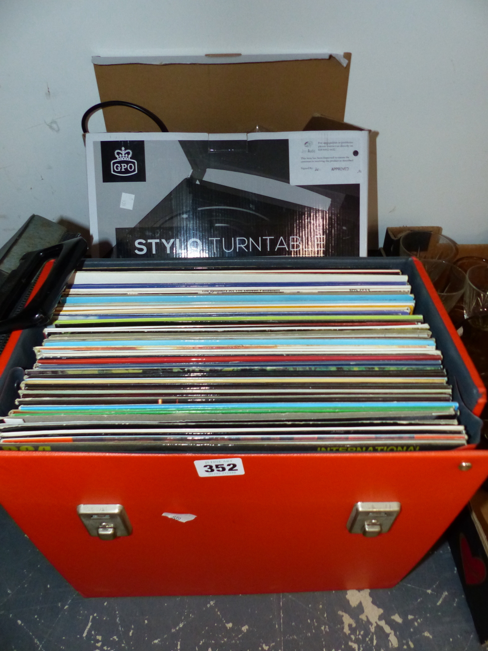 A SMALL COLLECTION OF EASY LISTENING VINYL RECORDS, A "STILO" TURNTABLE BOXED AND A TYPEWRITER.