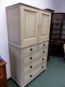 A 19TH CENTURY PINE COUNTRY MADE CABINET WITH PAINTED DECORATION, CUPBOARD SECTION ABOVE BASE OF