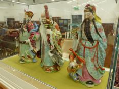 A SET OF THREE LARGE CHINESE FIGURES OF IMMORTALS.