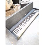 A VINTAGE ELECTRIC KEYBOARD WITHIN A CARRYING CASE -POSSIBLY GERMAN