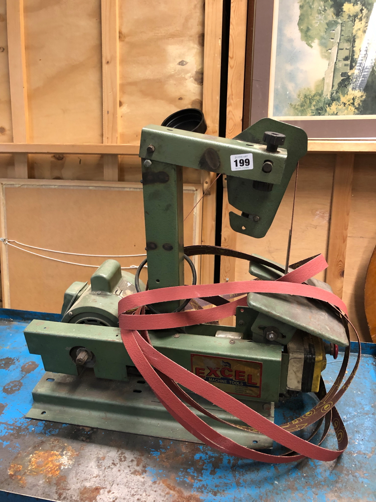 AN EXCEL BENCH TOP BELT SANDER.