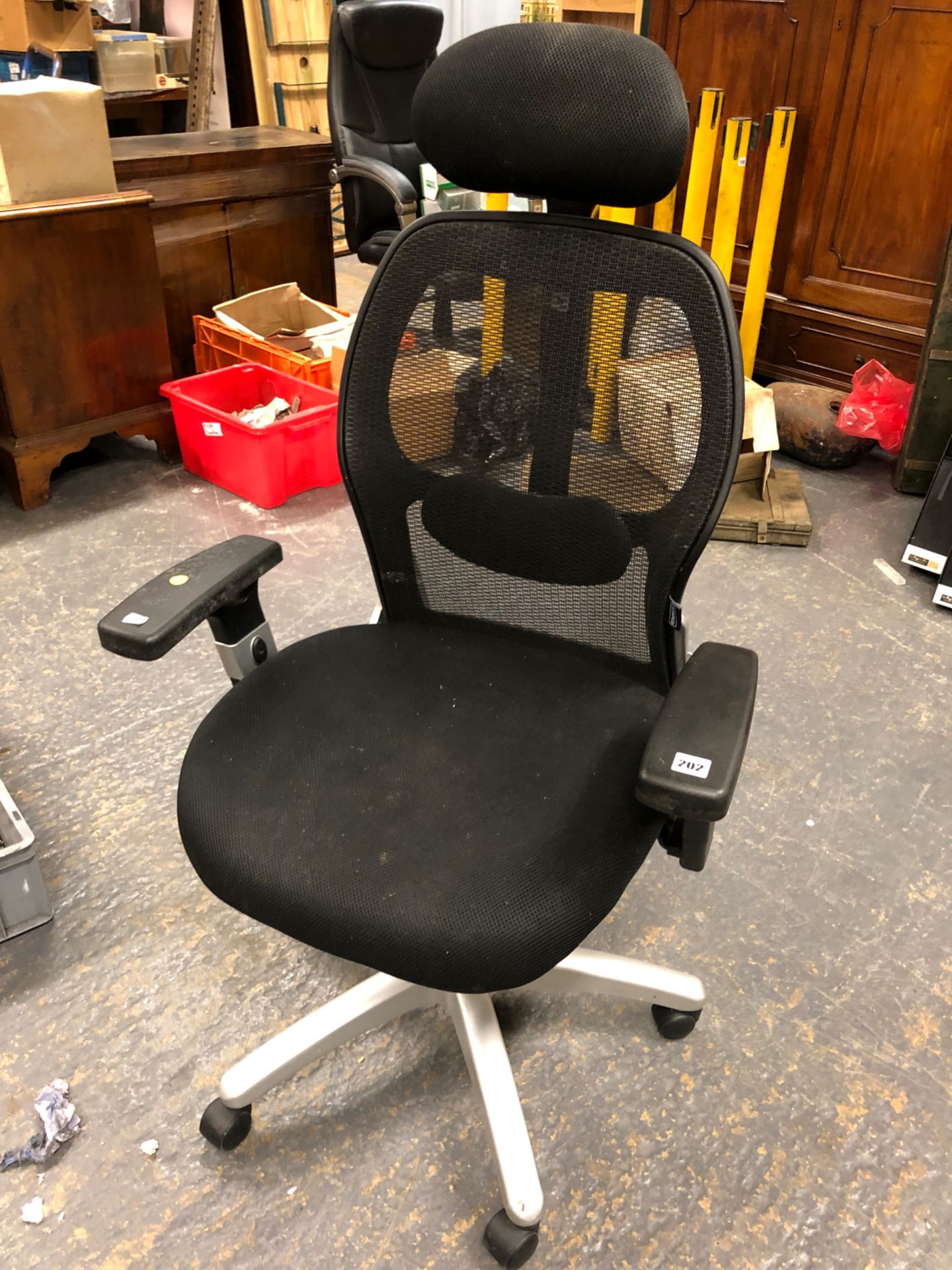 A STAPLES ERGONOMIC OFFICE CHAIR.