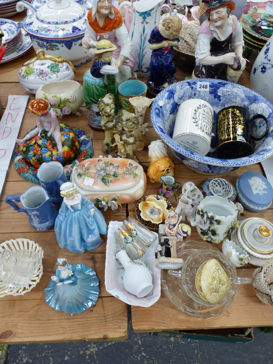 WEDGWOOD MUGS, STAFFORDSHIRE COBBLER AND COMPANION, MAJOLICA AND OTHER FIGURES TOGETHER WITH