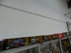TWELVE BOXED DIE CAST CARS BY BURAGO, MAISTO, MOTOR MAX, TONKA AND OTHERS