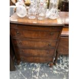 A 20th C. BURR WOOD CHEST WITH A BRUSHING SLIDE ABOVE FOUR DRAWERS AND CABRIOLE LEGS. W 64 x D