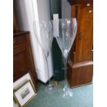 A PAIR OF OVERSIZED CHAMPAGNE FLUTE GLASSES.