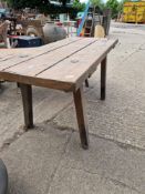A RUSTIC PINE BENCH
