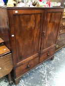 A 19th C. MAHOGANY CABINET, THE TWO DOORS ENCLOSING SHELVES ABOVE TWO SHORT DRAWERS AND THE