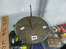 A WEATHERED BRONZE SUNDIAL
