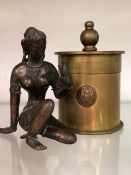 AN ANTIQUE EASTERN BRONZE DEITY FIGURE TOGETHER WITH A TRENCH ART LIDDED POT.