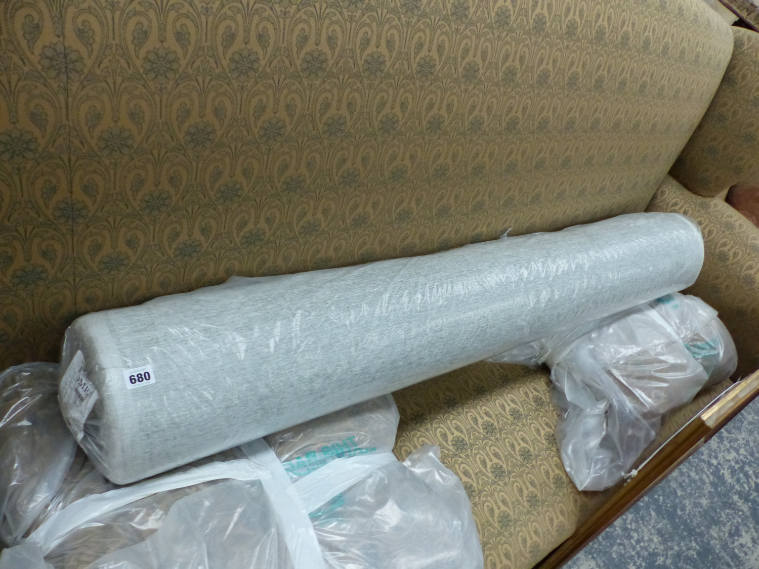 A LARGE ROLL OF LAURA ASHLEY BROCADE FABRIC AS NEW IN SEALED ROLL, MAPLETON SAGE PATTERN.