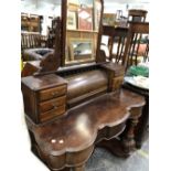 A MAHOGANY DUCHESSE DRESSING TABLE WITH ROUND ARCH MIRROR BACK, THE FLUTED LEGS ENDING IN MASSIVE