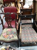 A PAIR OF VICTORIAN CARVED OAK ELBOW CHAIRS, A RED LEATHER UPHOLSTERED ELBOW CHAIR TOGETHER WITH A